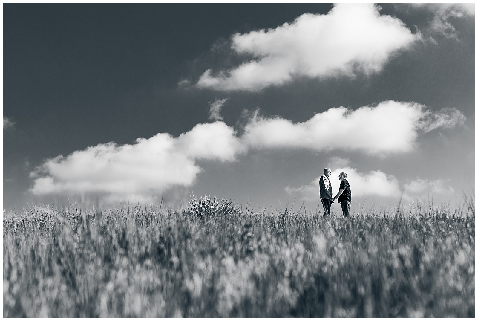 dramatic black and white engagement photo of same sex couple