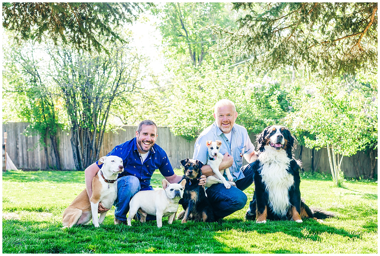 same sex couple family photo with dogs