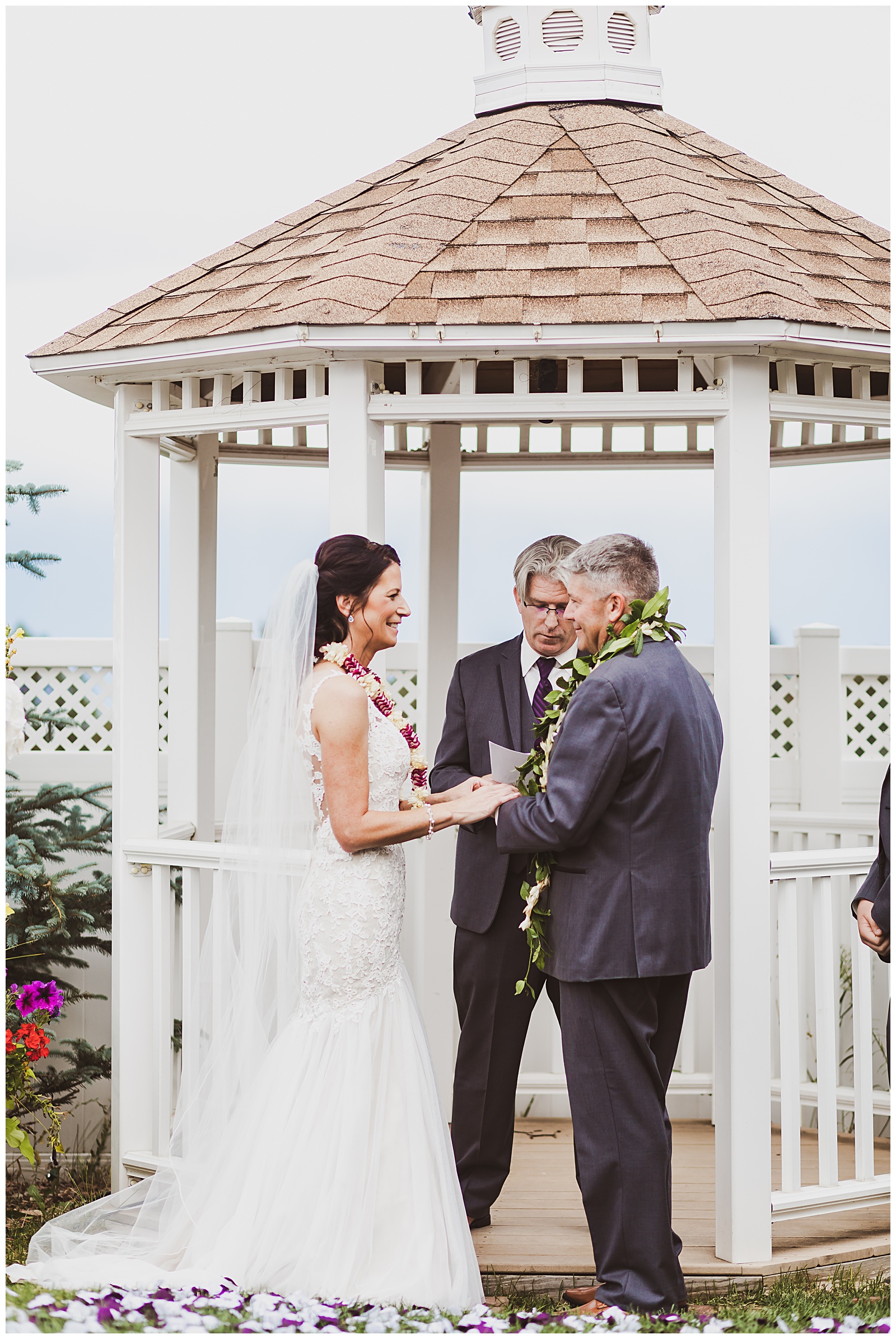 bride and groom in front of gazebo