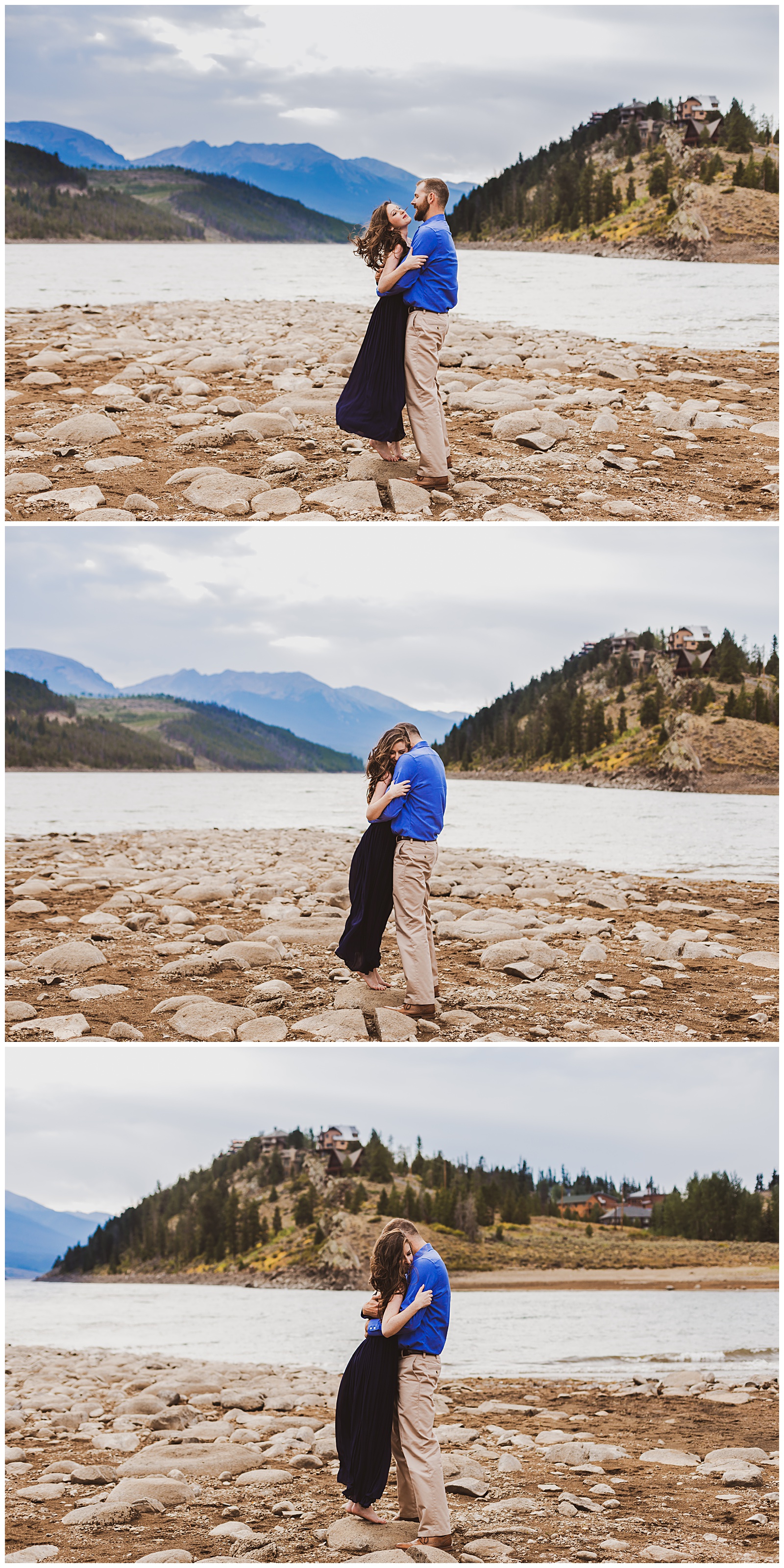 a couple embraces on a lake shore in the mountains