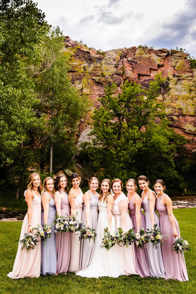 Bride and bridesmaids pose together